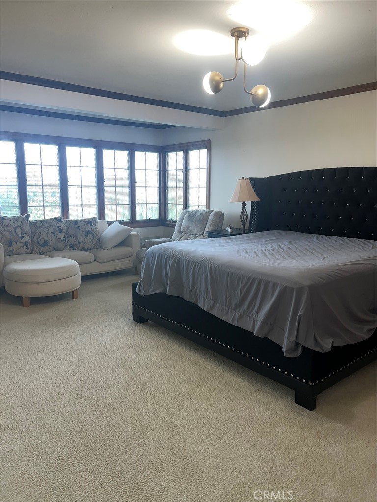 6747 Verde Ridge Road Rancho Palos Verdes, CA 90275 - Photo 29 of 34 a spacious bedroom with a bed and a couch