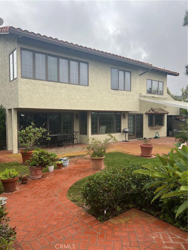 6747 Verde Ridge Road Rancho Palos Verdes, CA 90275 - Photo 33 of 34 a front view of a house with a yard and potted plants