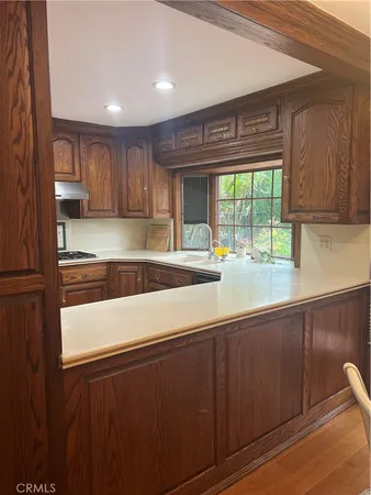 a kitchen with a sink and large window