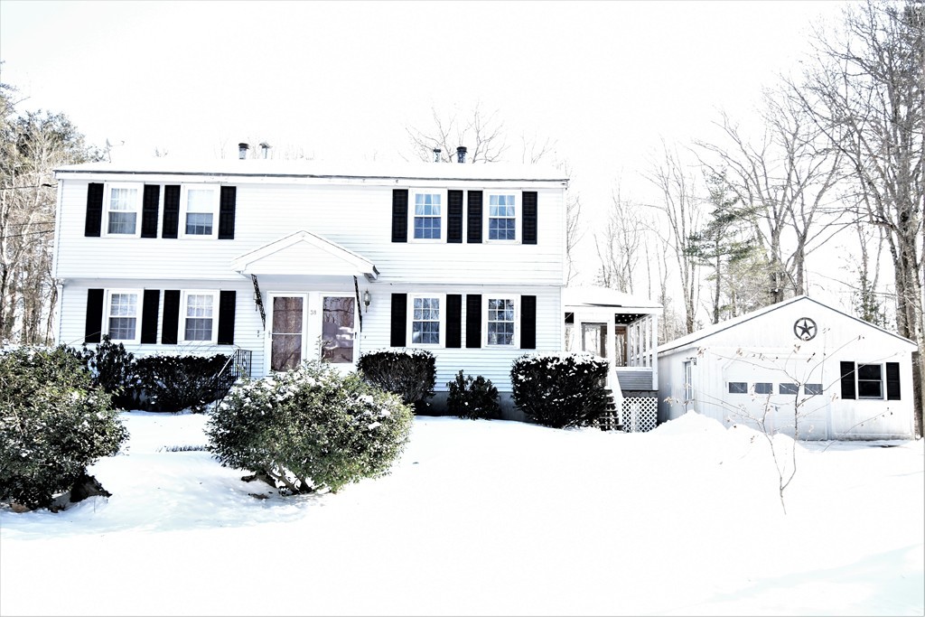 38 Juniper Road, Unit R Derry, NH 03038 - Photo 2 of 22 a front view of a residential houses with yard and trees