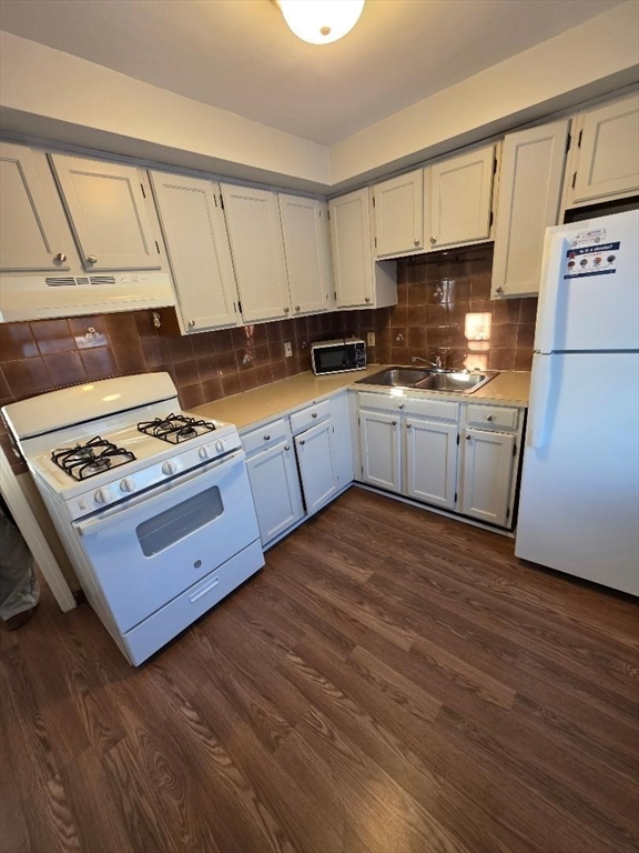 a kitchen with stainless steel appliances granite countertop a stove a sink dishwasher and a refrigerator