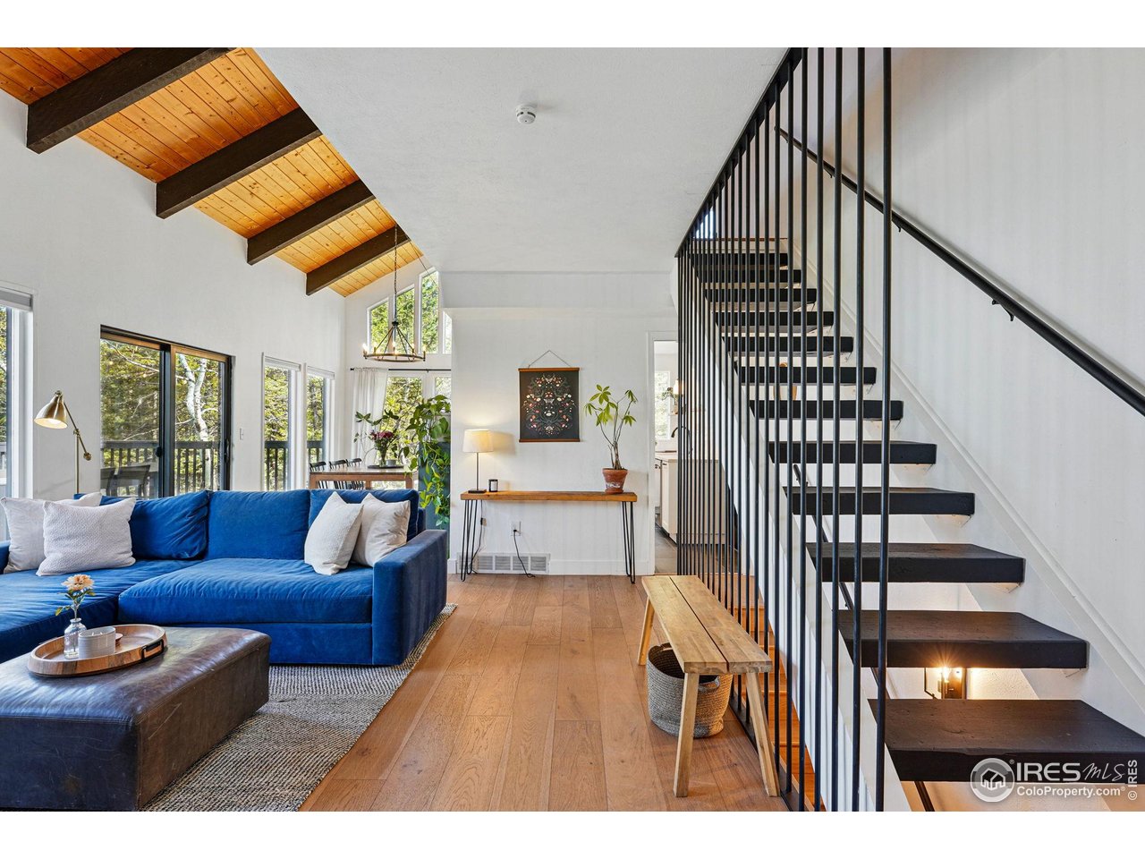 1750 Deer Trail Road Boulder, CO 80302 - Photo 13 of 50 a living room with furniture and wooden floor