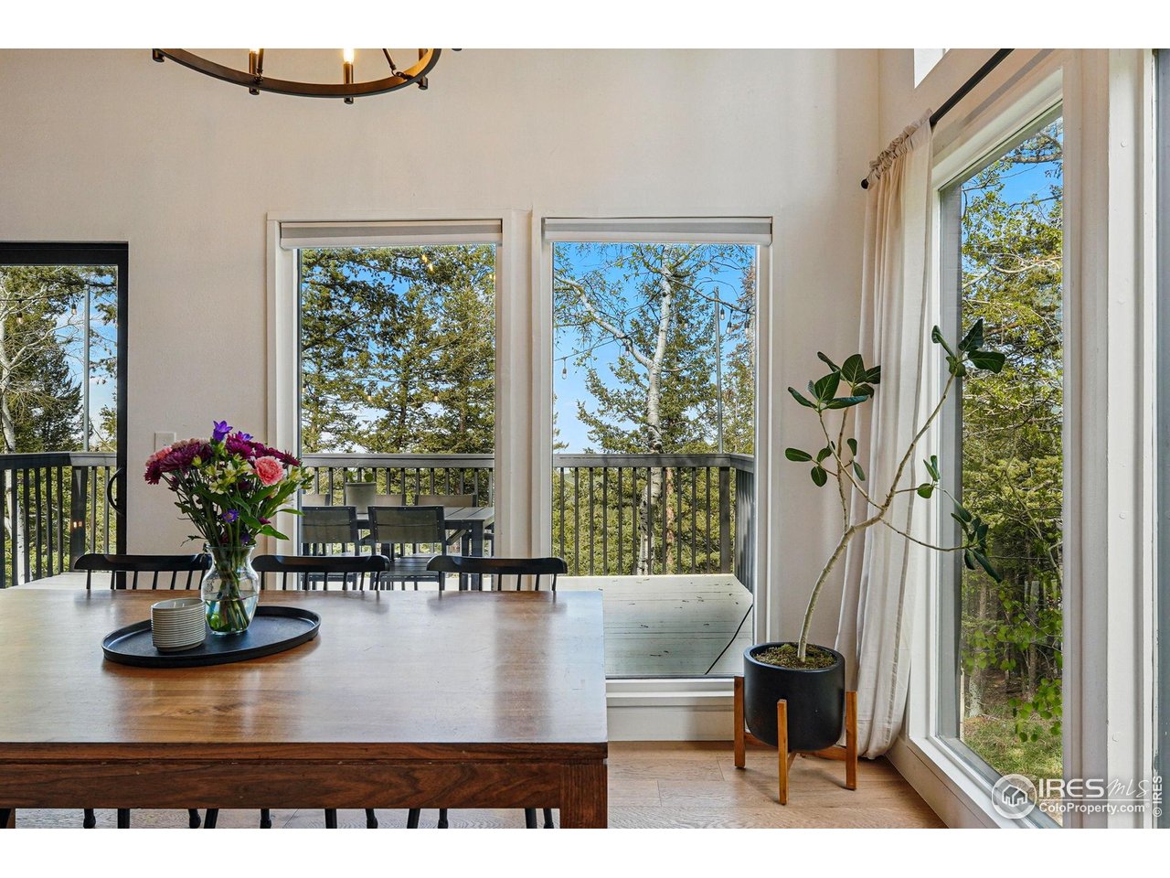 1750 Deer Trail Road Boulder, CO 80302 - Photo 17 of 50 a view of a dining room with furniture window and outside view