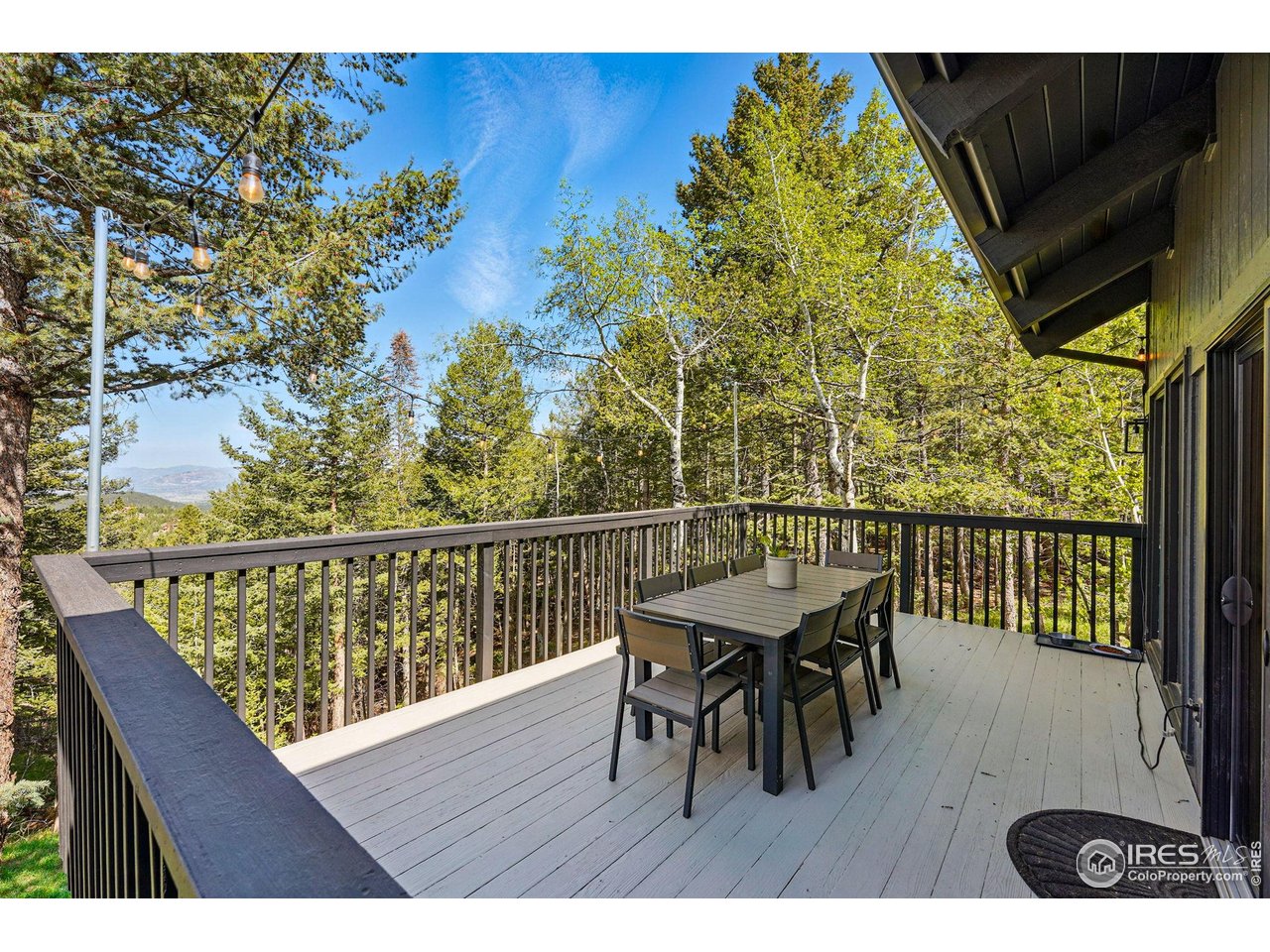 1750 Deer Trail Road Boulder, CO 80302 - Photo 18 of 50 a view of a balcony with table and chairs