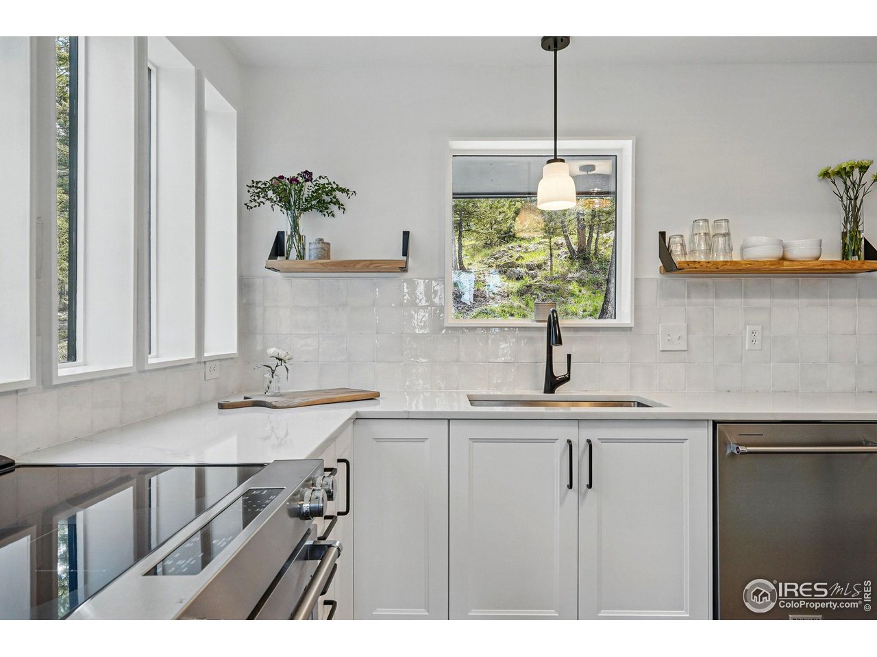 1750 Deer Trail Road Boulder, CO 80302 - Photo 20 of 50 a kitchen with a sink window and cabinets