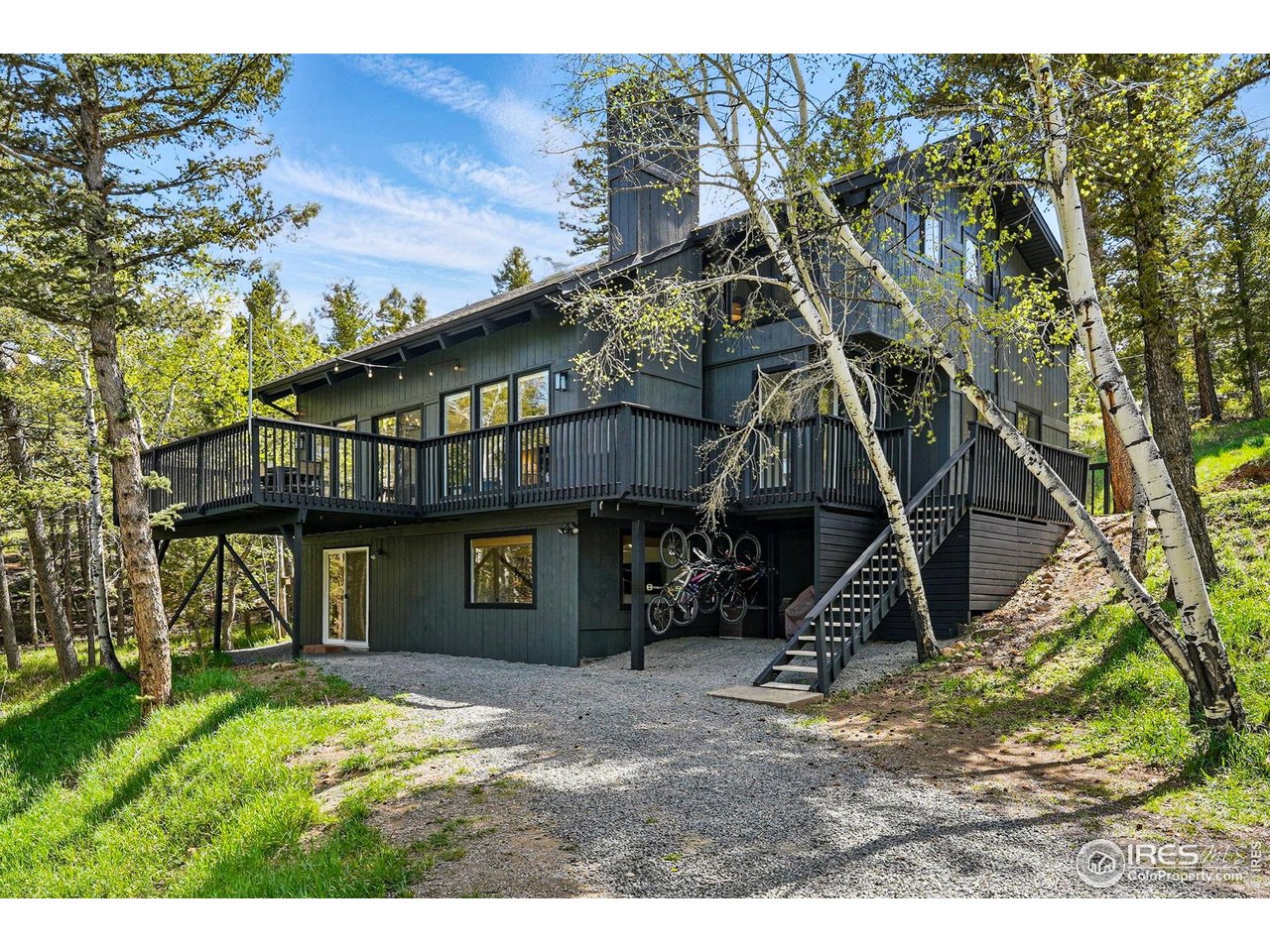 1750 Deer Trail Road Boulder, CO 80302 - Photo 2 of 50 a view of a house with a yard