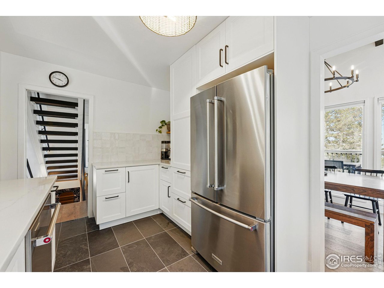 1750 Deer Trail Road Boulder, CO 80302 - Photo 22 of 50 a kitchen with white cabinets and refrigerator