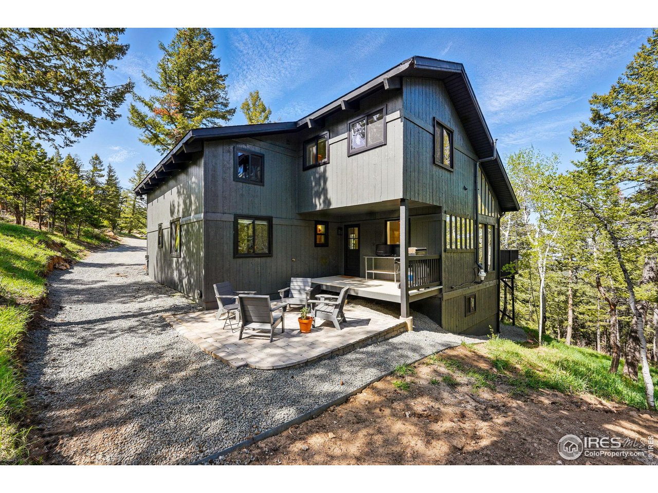 1750 Deer Trail Road Boulder, CO 80302 - Photo 28 of 50 a view of house with backyard outdoor seating and green space