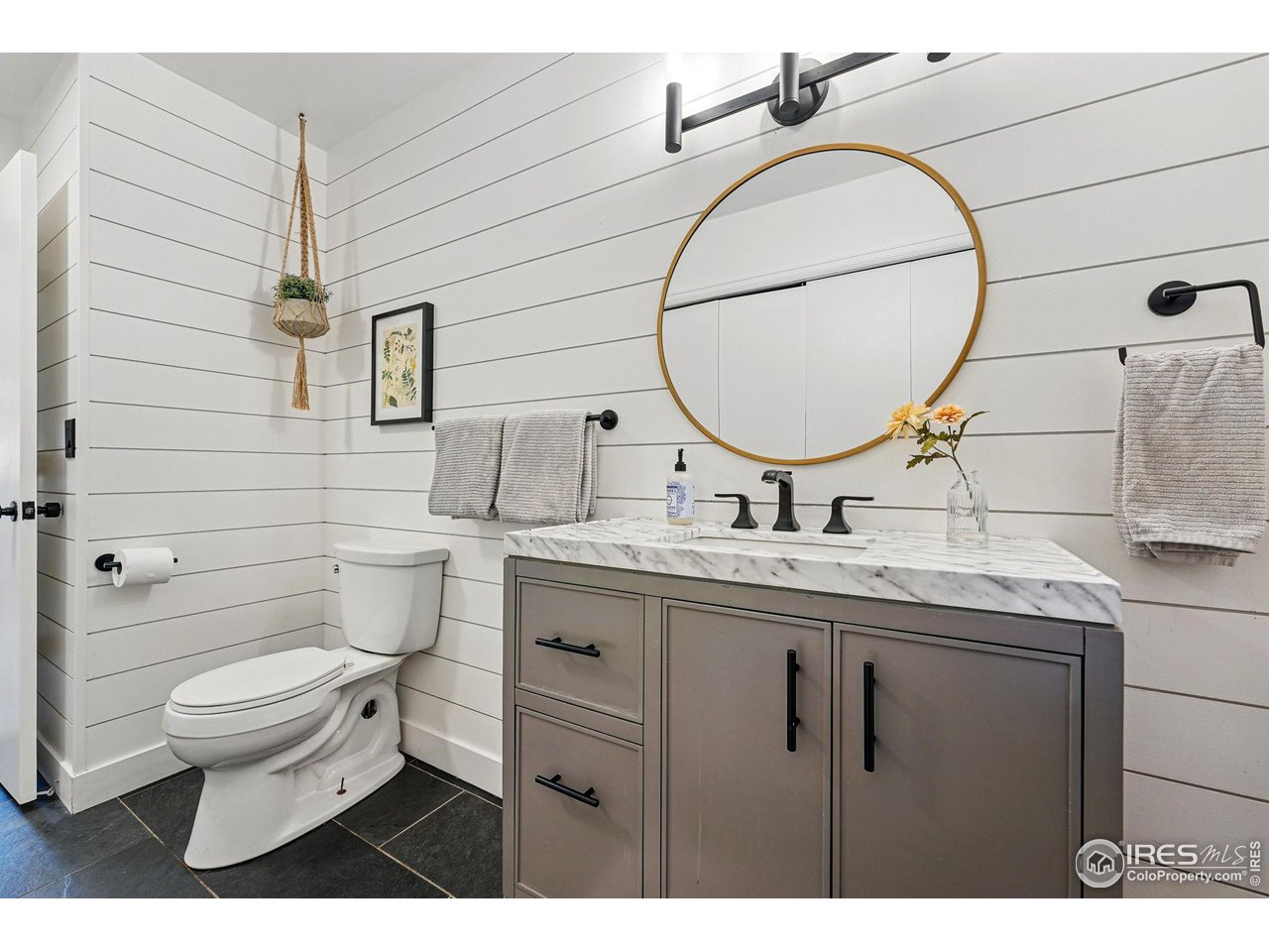 1750 Deer Trail Road Boulder, CO 80302 - Photo 29 of 50 a bathroom with a granite countertop toilet sink and mirror