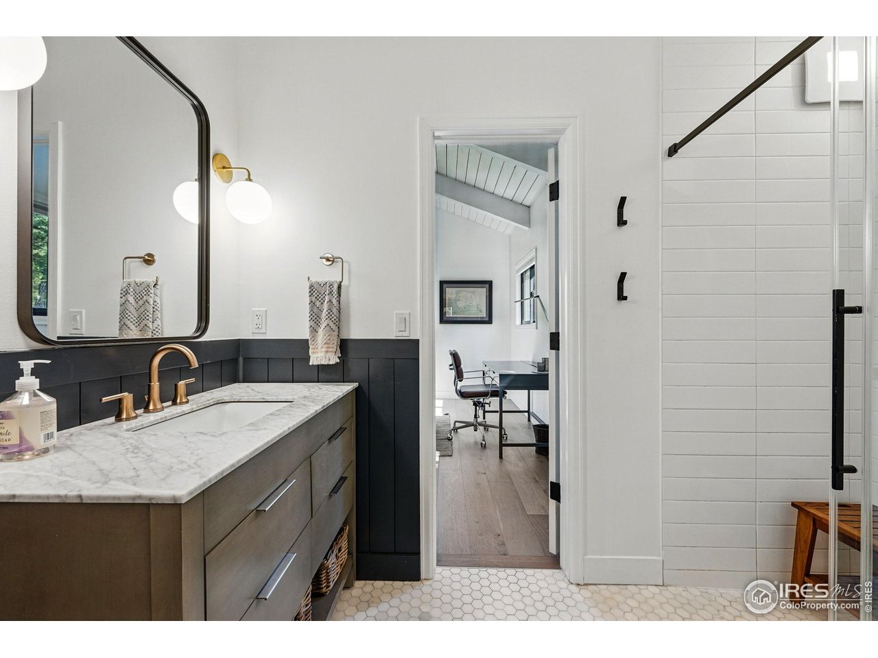 1750 Deer Trail Road Boulder, CO 80302 - Photo 41 of 50 a bathroom with a sink vanity granite and a mirror
