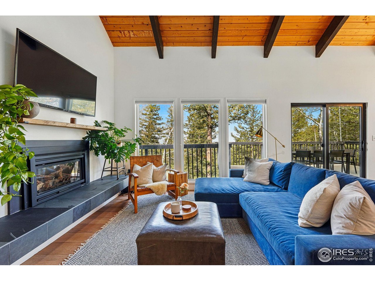 1750 Deer Trail Road Boulder, CO 80302 - Photo 6 of 50 a living room with furniture and a flat screen tv