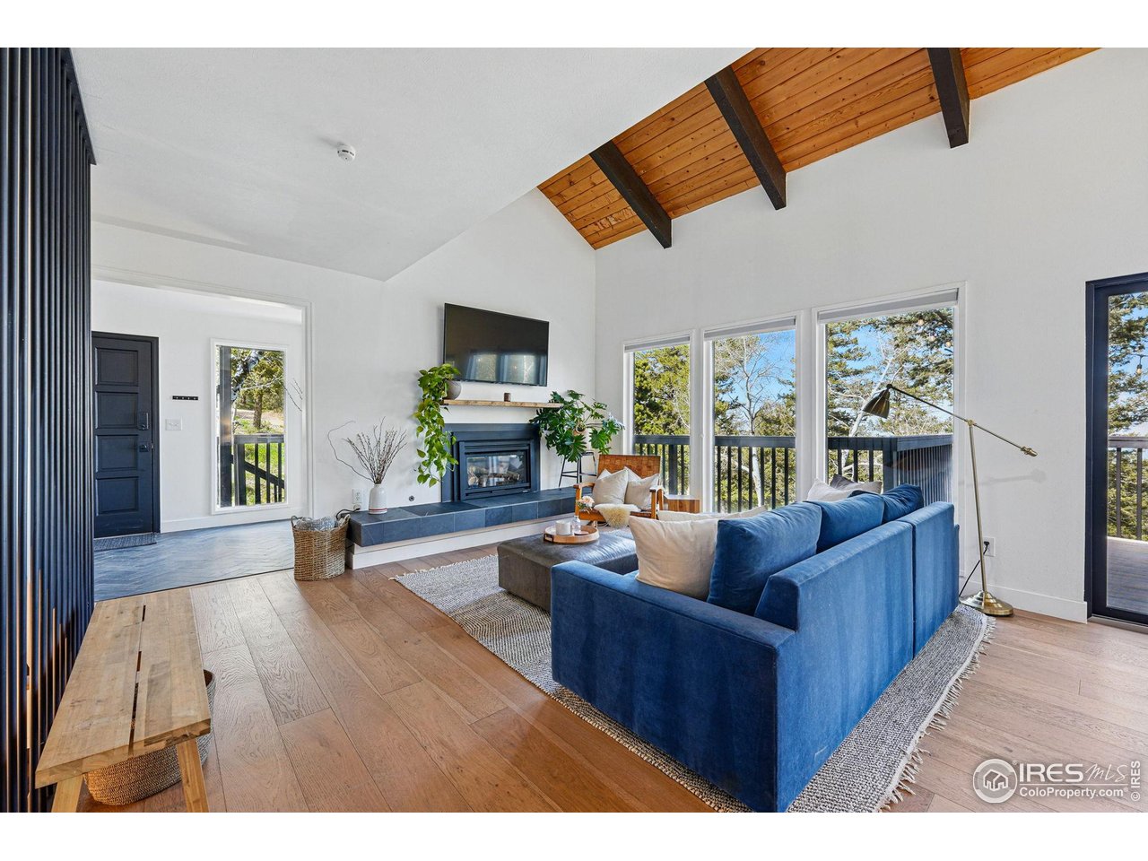 1750 Deer Trail Road Boulder, CO 80302 - Photo 7 of 50 a living room with furniture and a fireplace