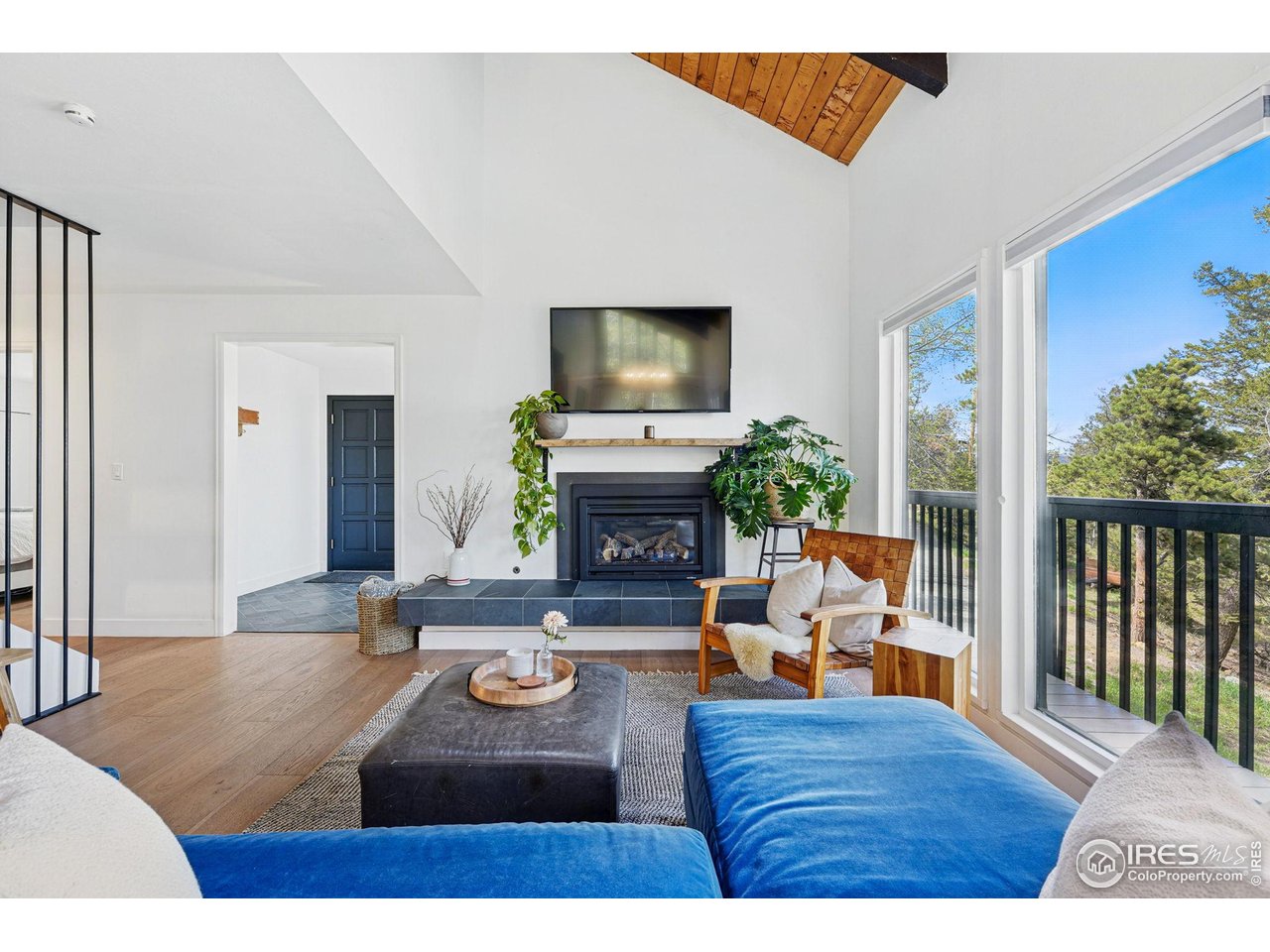 1750 Deer Trail Road Boulder, CO 80302 - Photo 8 of 50 a living room with furniture and a fireplace