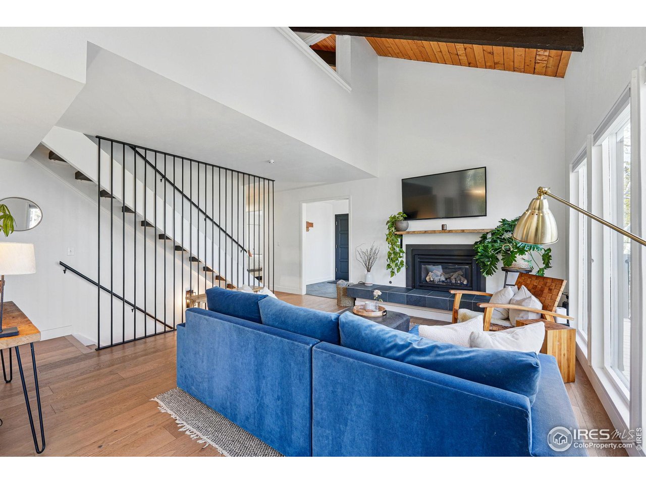 1750 Deer Trail Road Boulder, CO 80302 - Photo 9 of 50 a living room with furniture a flat screen tv and a wooden floor