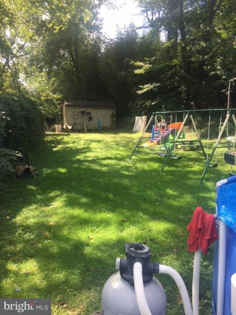 7137 Rice Street Falls Church, VA 22042 - Photo 16 of 17 a view of a house with backyard