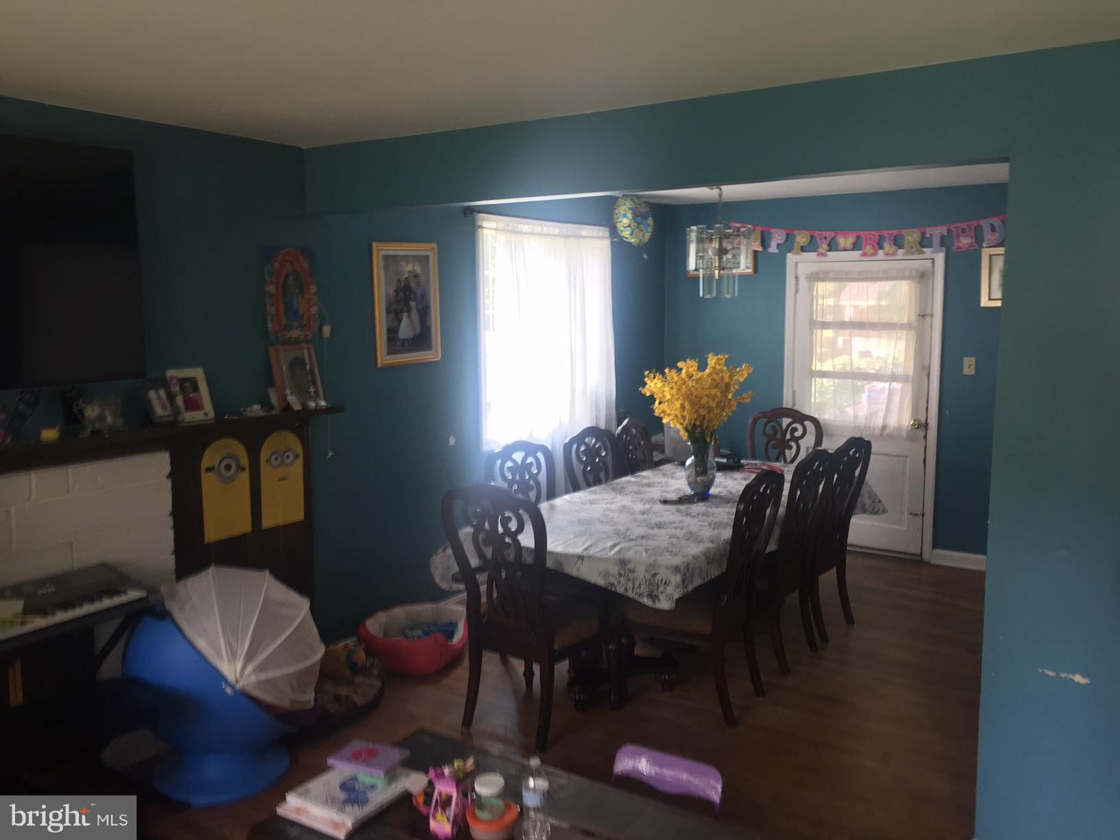 7137 Rice Street Falls Church, VA 22042 - Photo 3 of 17 a dining room with furniture and window