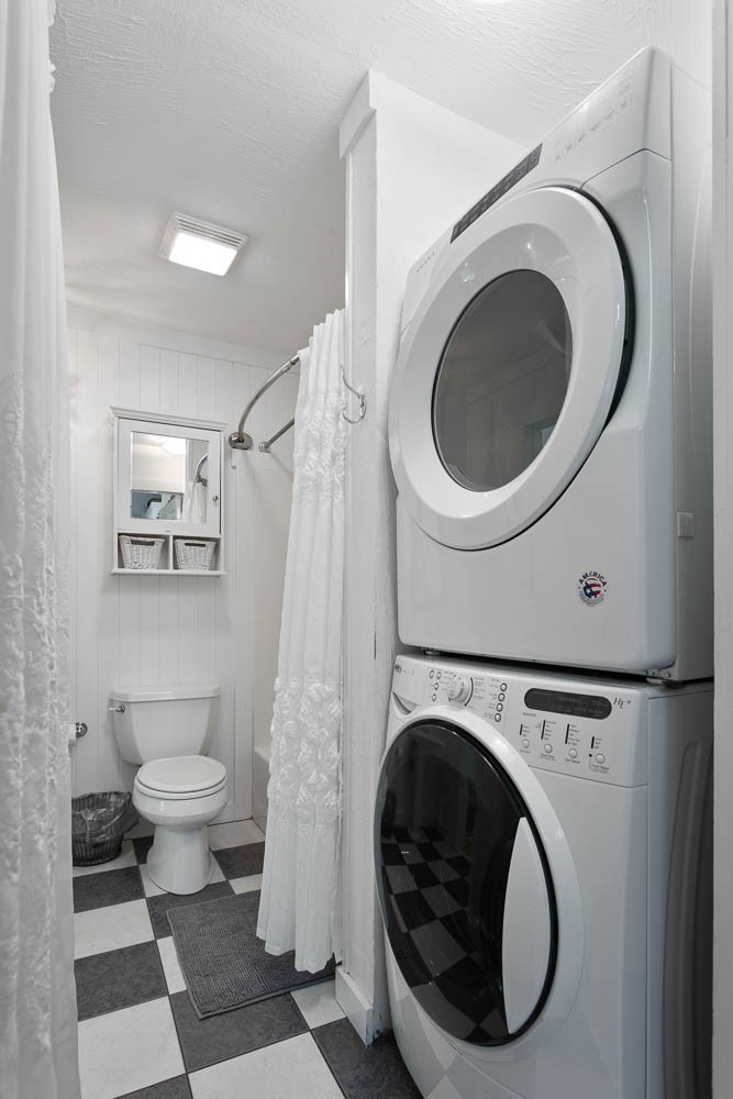 5672 Pinewood Road Franklin, TN 37064 - Photo 15 of 55 a bathroom with a toilet and a washing machine