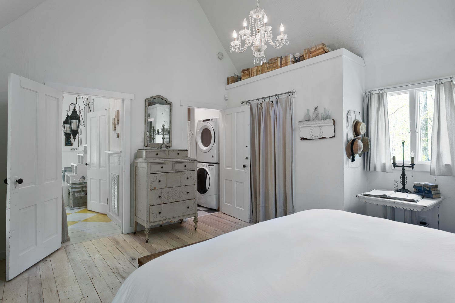 5672 Pinewood Road Franklin, TN 37064 - Photo 20 of 55 a bedroom with a bed and a chandelier