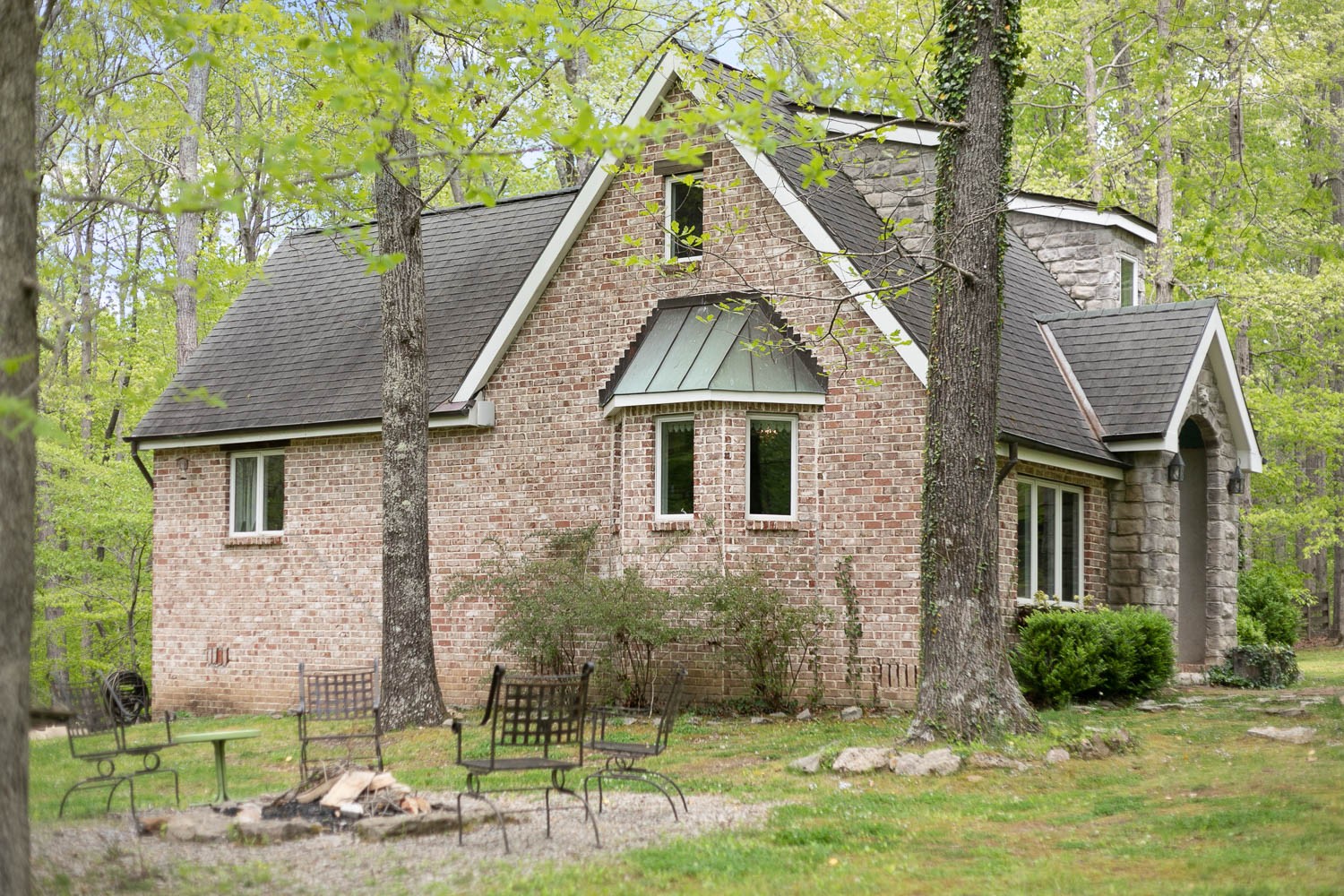 5672 Pinewood Road Franklin, TN 37064 - Photo 37 of 55 a view of a brick house with a yard plants and large tree