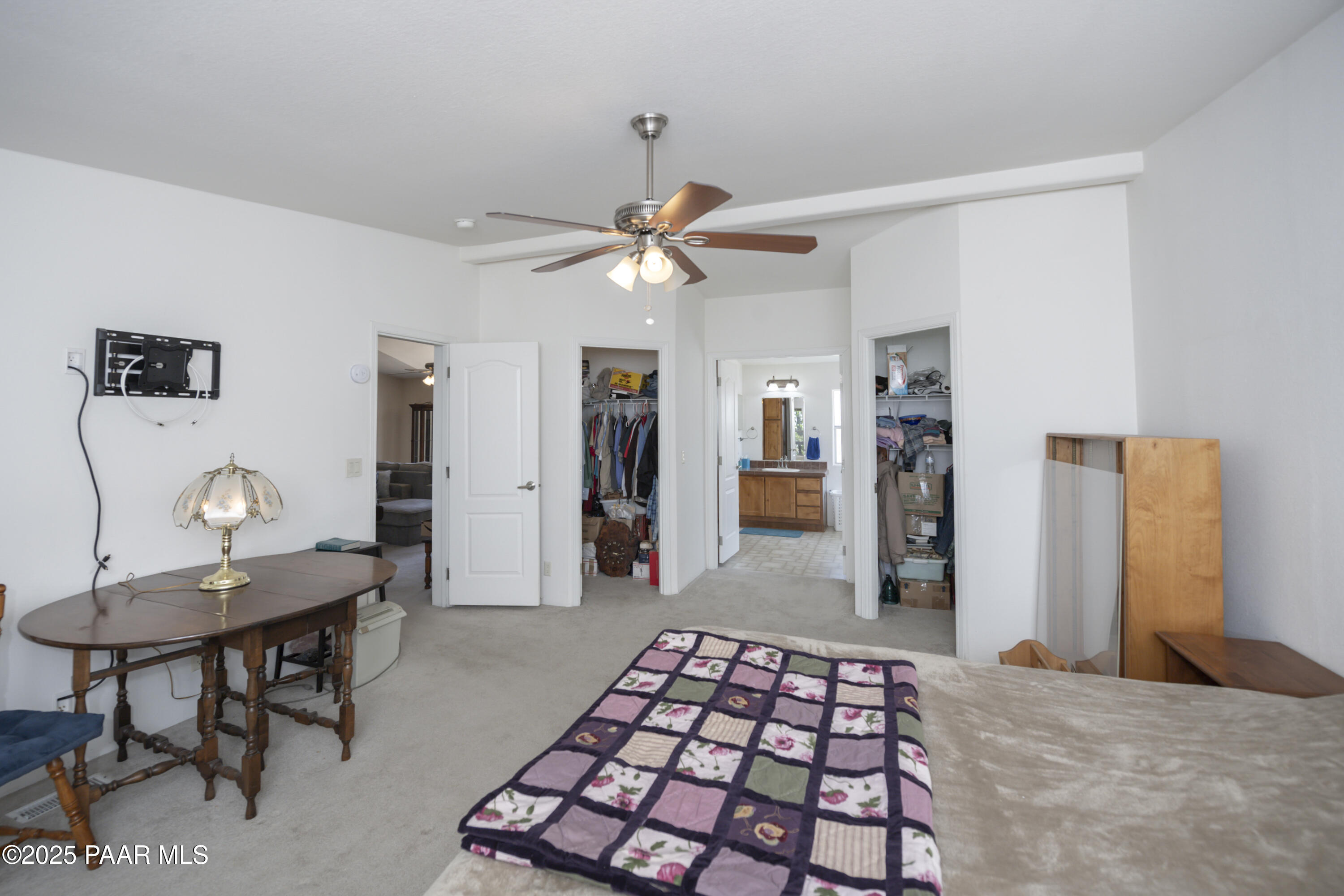 17985 East Hunters Lane Dewey, AZ 86327 - Photo 24 of 41 a bedroom with furniture and a chandelier