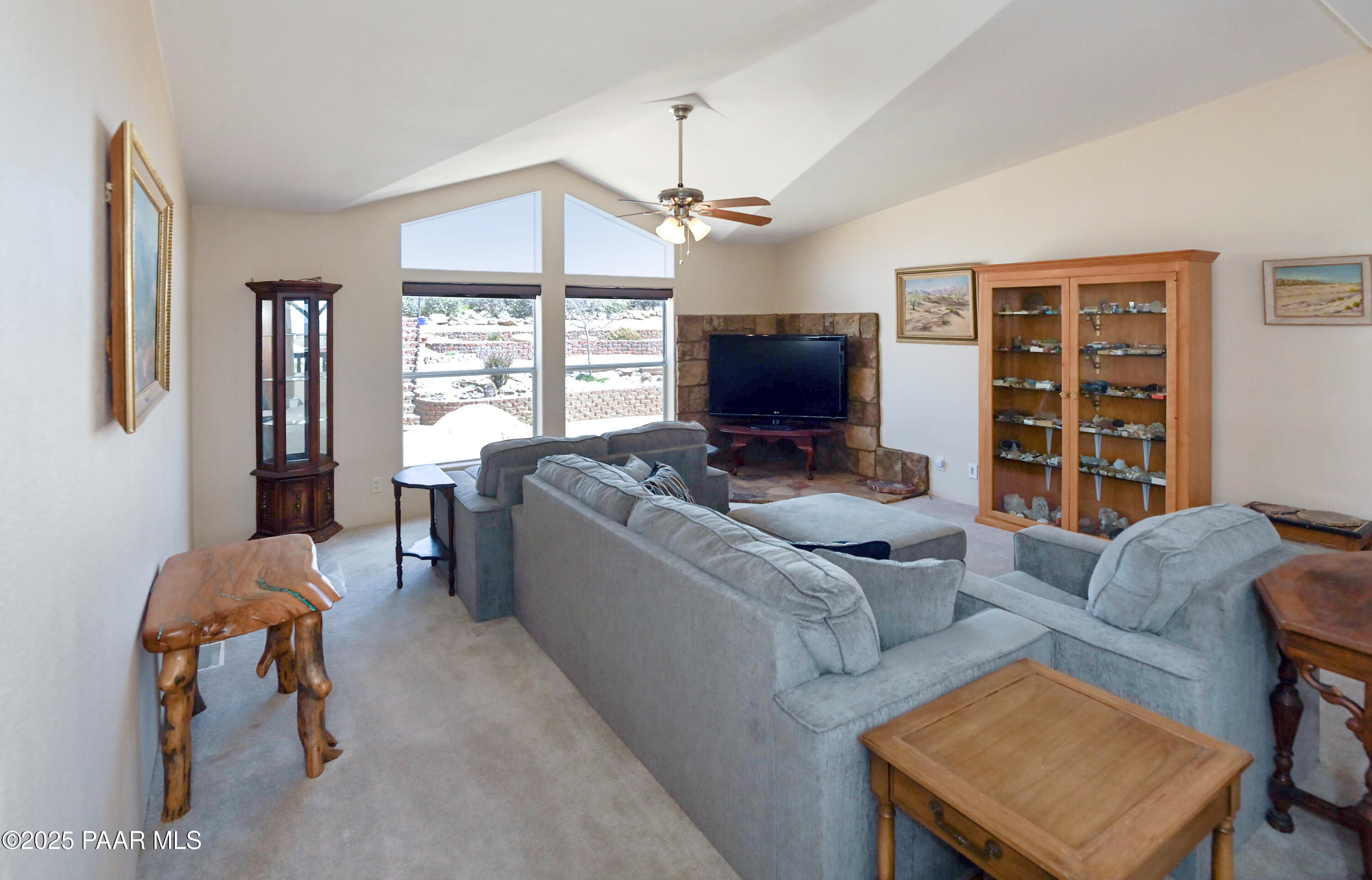 17985 East Hunters Lane Dewey, AZ 86327 - Photo 6 of 41 a living room with furniture a flat screen tv and a window