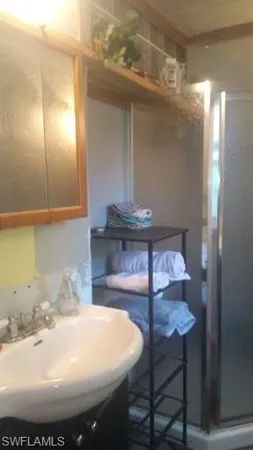 a bathroom with a sink and a mirror