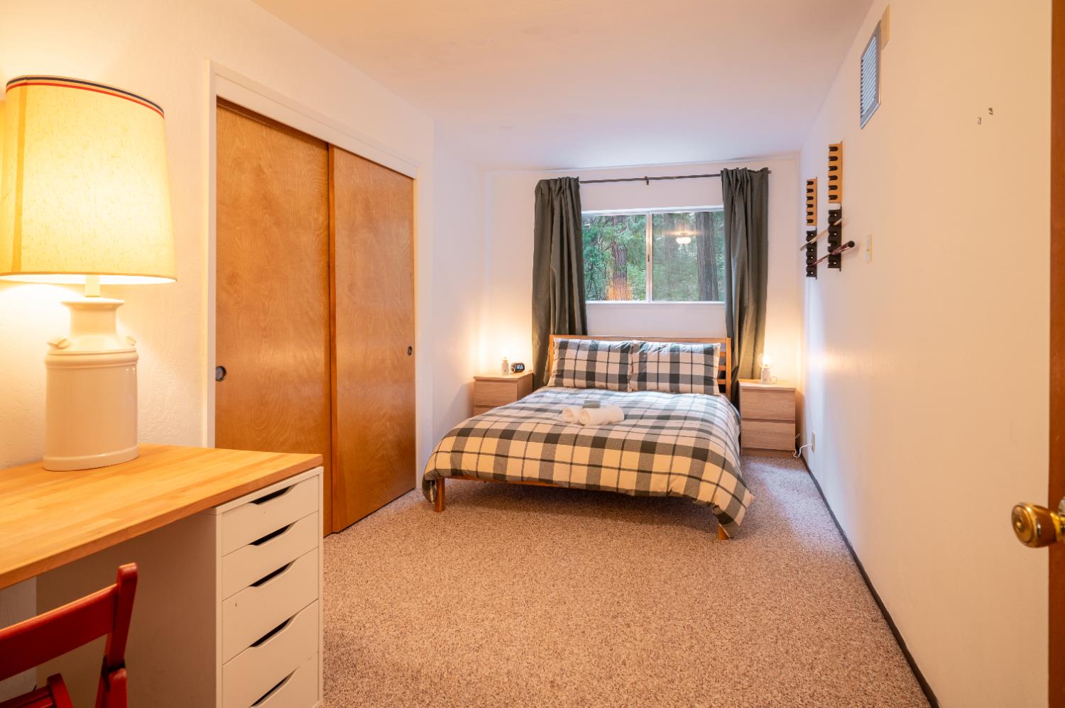 3790 Apache Road Arnold, CA 95223 - Photo 23 of 41 a bedroom with a bed and wooden floor