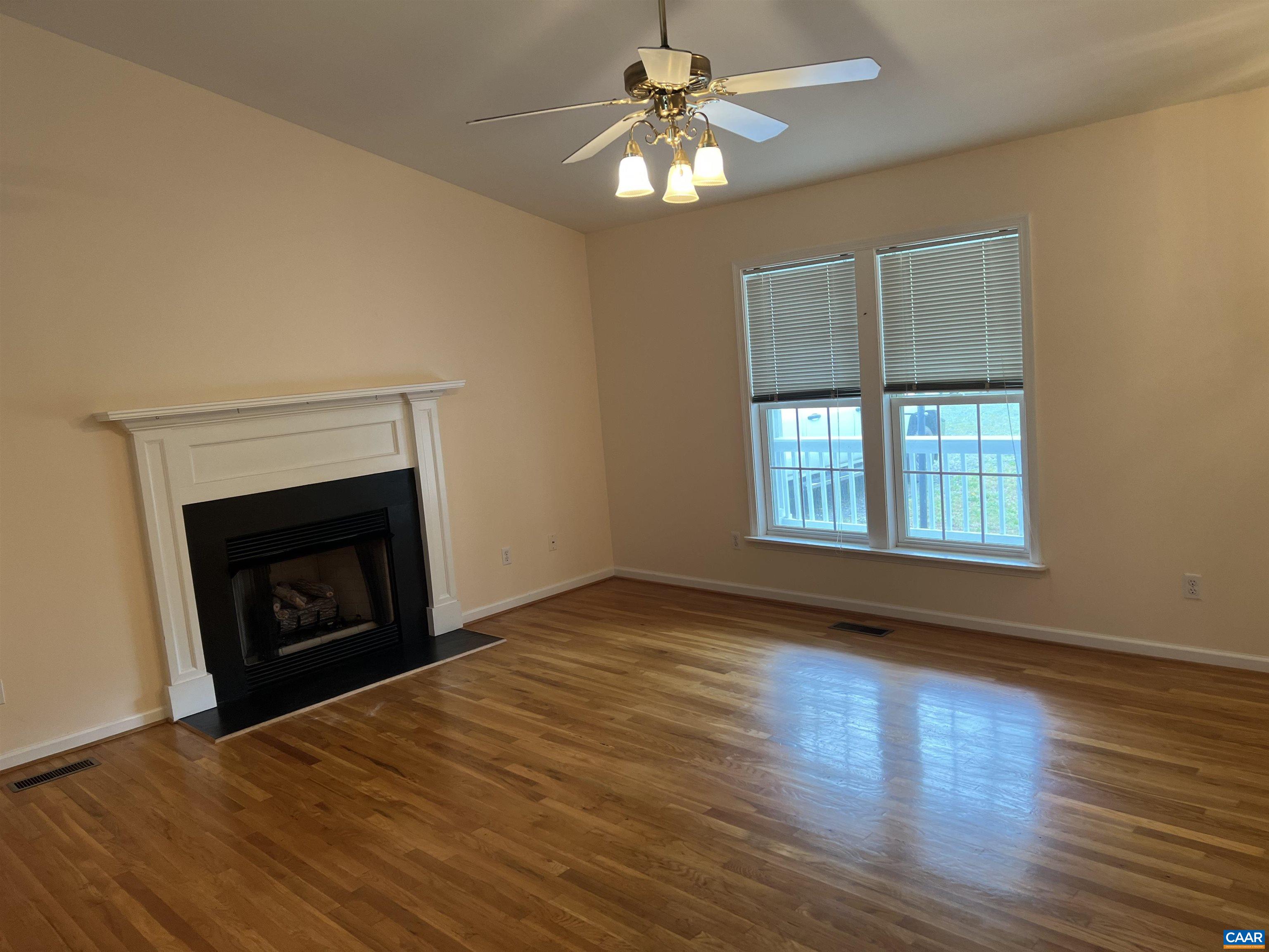 30 Haversack Road Palmyra, VA 22963 - Photo 3 of 31 a view of empty room with wooden floor and fireplace