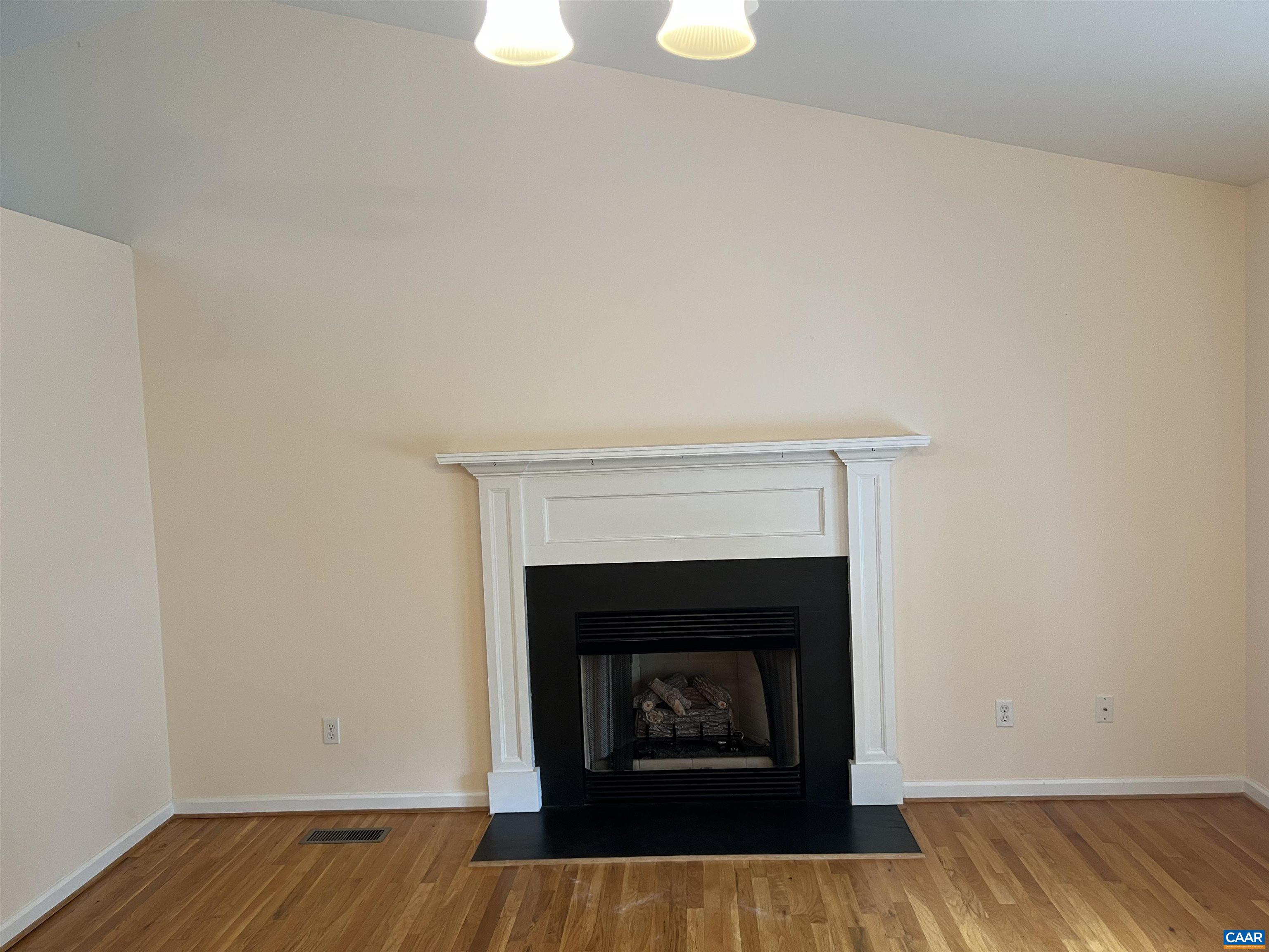 30 Haversack Road Palmyra, VA 22963 - Photo 7 of 31 a view of an empty room with wooden floor and a fireplace