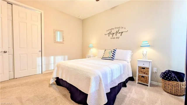 a bedroom with a bed and a table in it