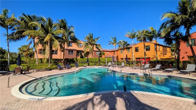 a view of swimming pool with outdoor seating