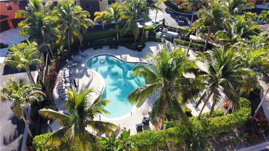 9051 Capistrano Street North, Unit 4308 Naples, FL 34113 - Photo 20 of 45 a backyard of a house with lots of green space