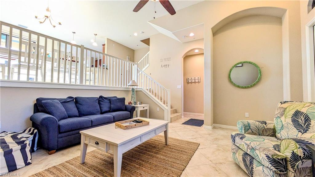 9051 Capistrano Street North, Unit 4308 Naples, FL 34113 - Photo 35 of 45 a living room with furniture and a rug