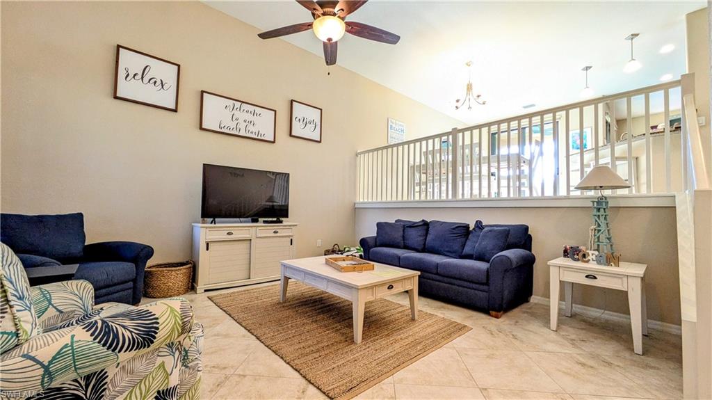 9051 Capistrano Street North, Unit 4308 Naples, FL 34113 - Photo 36 of 45 a living room with furniture a flat screen tv and a window