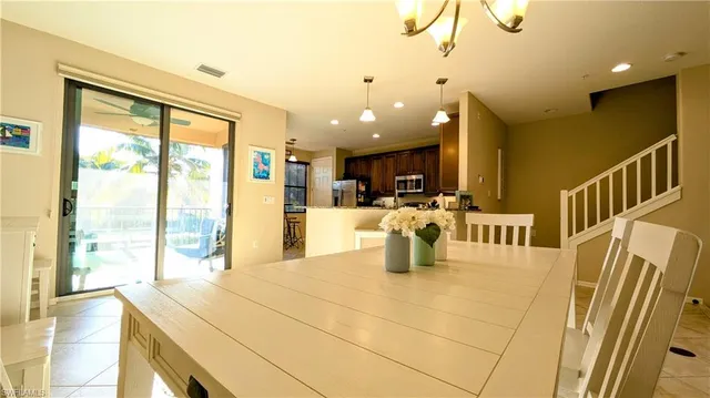 a view of kitchen with furniture and large window