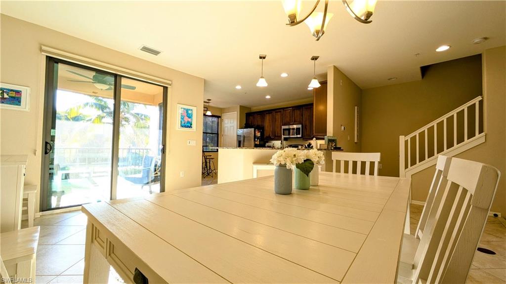 9051 Capistrano Street North, Unit 4308 Naples, FL 34113 - Photo 37 of 45 a view of kitchen with furniture and large window