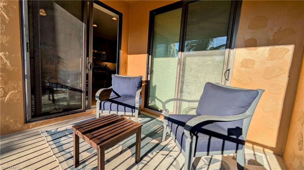 9051 Capistrano Street North, Unit 4308 Naples, FL 34113 - Photo 39 of 45 a view of a two chairs in the balcony