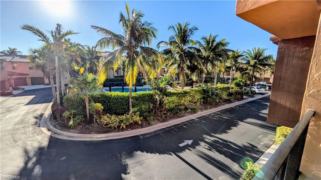 9051 Capistrano Street North, Unit 4308 Naples, FL 34113 - Photo 41 of 45 a view of a garden with a patio