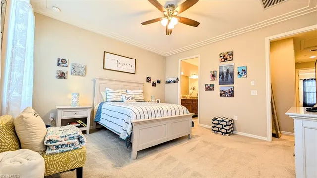 a spacious bedroom with a bed and a couch