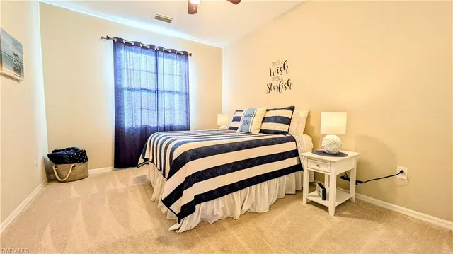 a bedroom with a bed and a chair