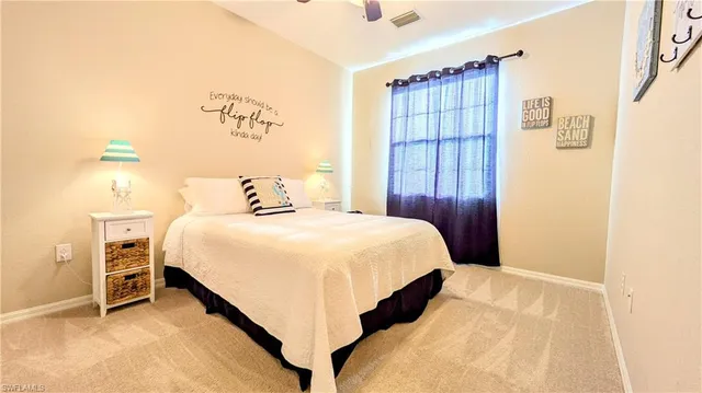 a bedroom with a bed and a table with wooden floor