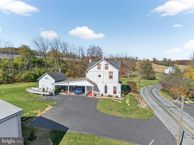 an aerial view of a house with a garden