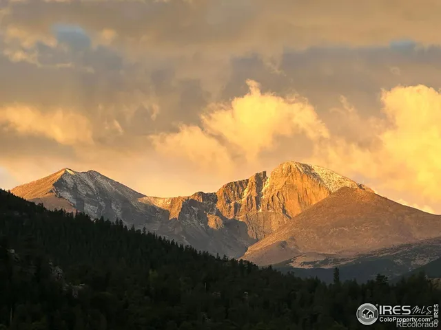 a view of a city with mountains in the background