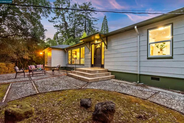 a front view of a house with garden