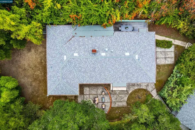 an aerial view of a house with yard and outdoor space