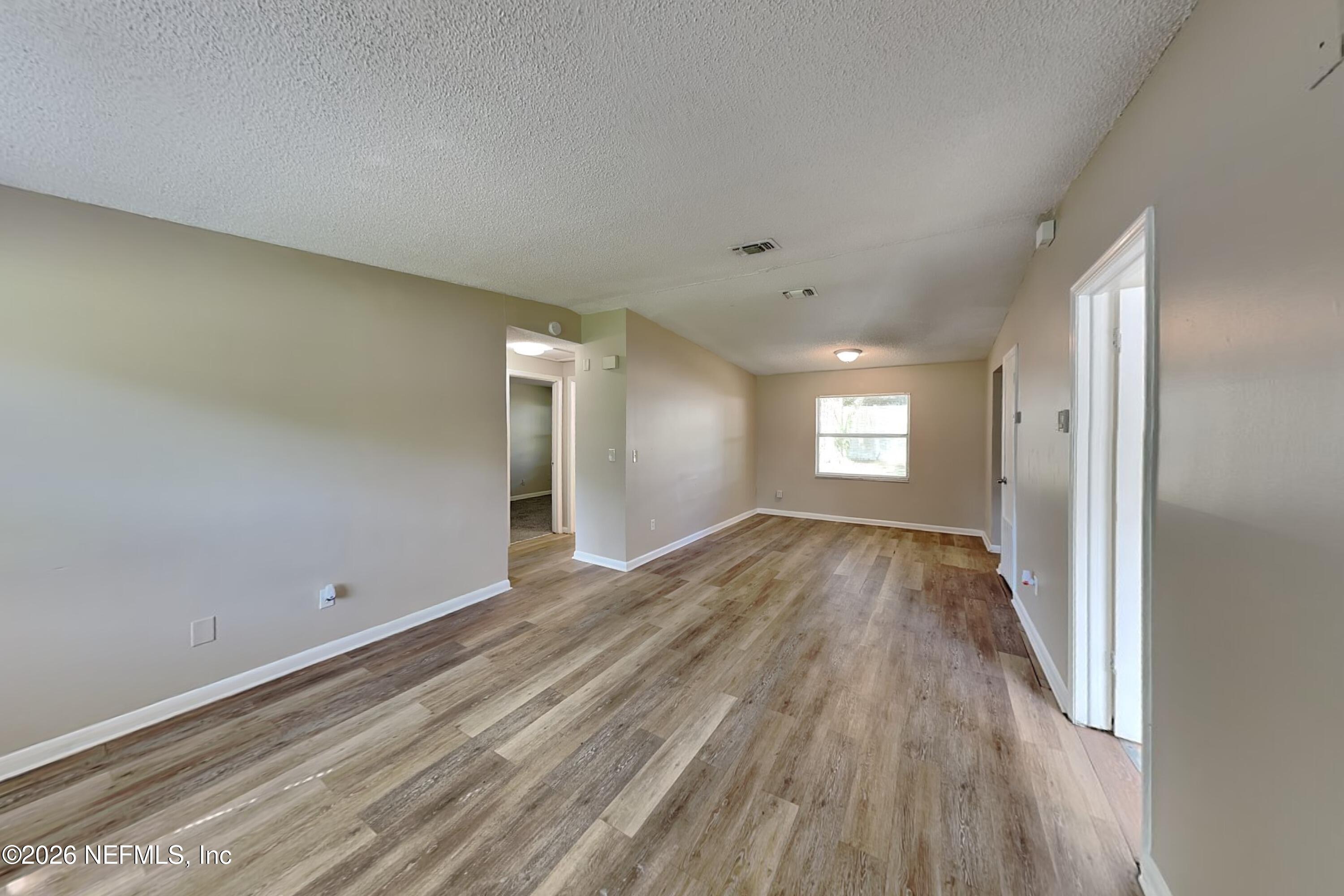 4888 Strato Road West Jacksonville, FL 32210 - Photo 4 of 19 3_Living_Room-01_Image_nOmqSSGXrM