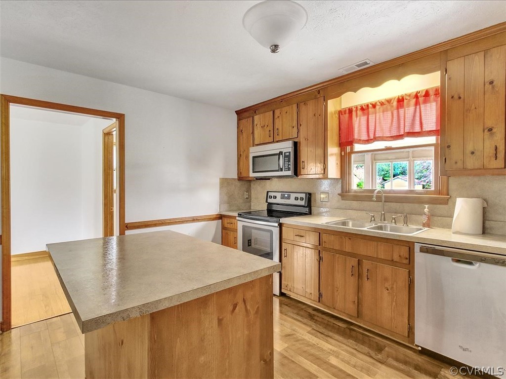 6881 Miller Road Richmond, VA 23231 - Photo 13 of 23 Moveable island also has overhang for bar stools.
