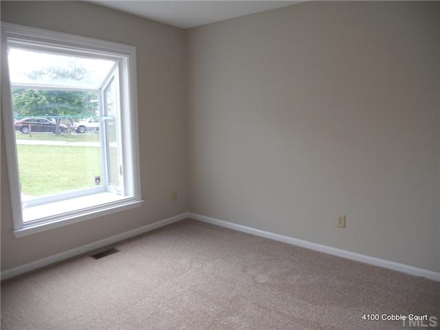4100 Cobble Court Raleigh, NC 27616 - Photo 14 of 21 an empty room with a window