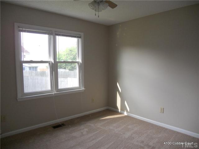 4100 Cobble Court Raleigh, NC 27616 - Photo 15 of 21 an empty room with a window