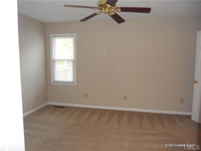 4100 Cobble Court Raleigh, NC 27616 - Photo 16 of 21 an empty room with a window